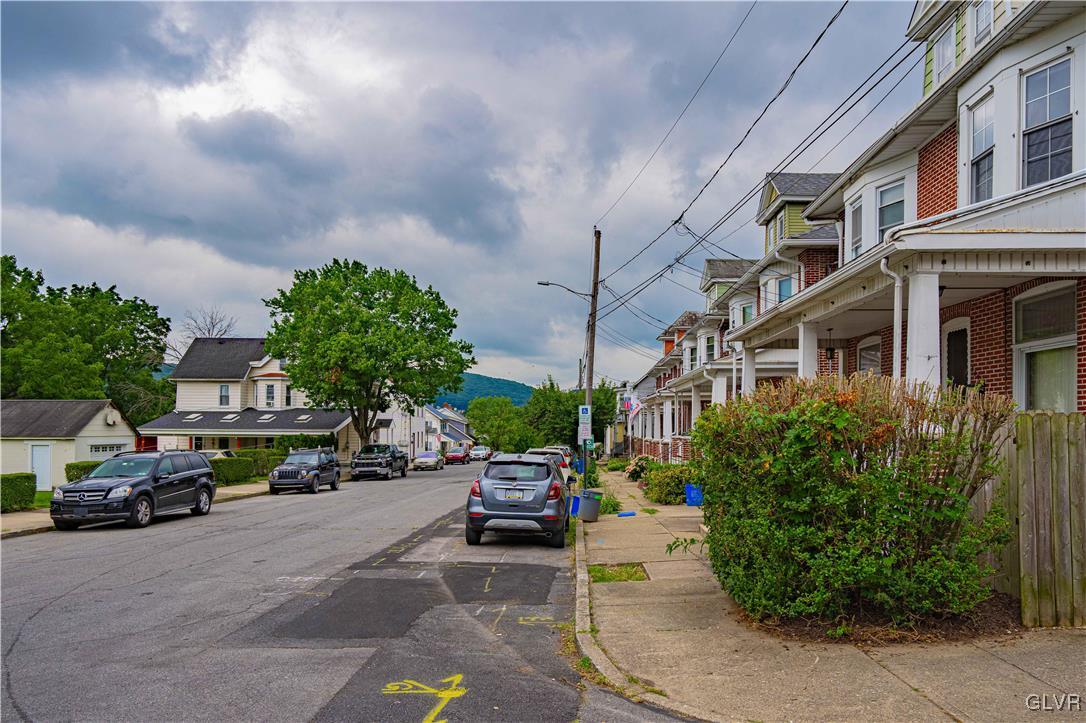 353 Hanover Street Bethlehem, PA 18018 - Photo 3 of 38 a view of road with card parked on side and retail shops