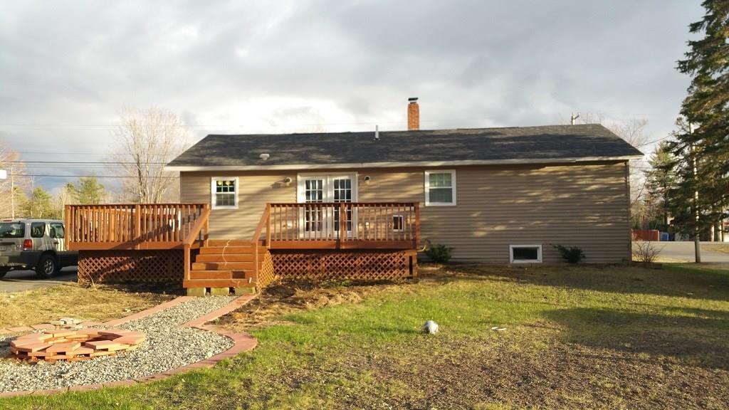 522 Main Street Madison, ME 04950 - Photo 29 of 34 Back of home with deck and fire pit...