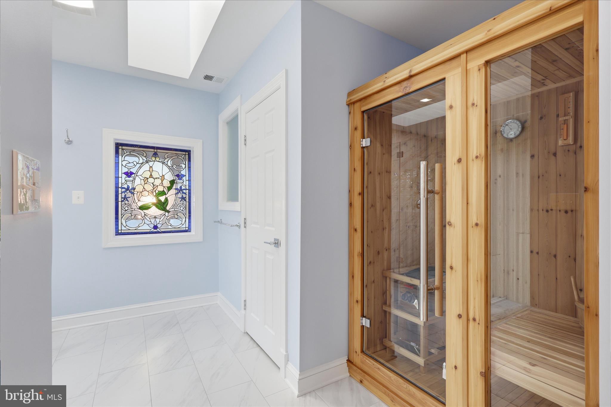 1051 Kelso Road Great Falls, VA 22066 - Photo 18 of 40 Cedar sauna and glass window in primary bath