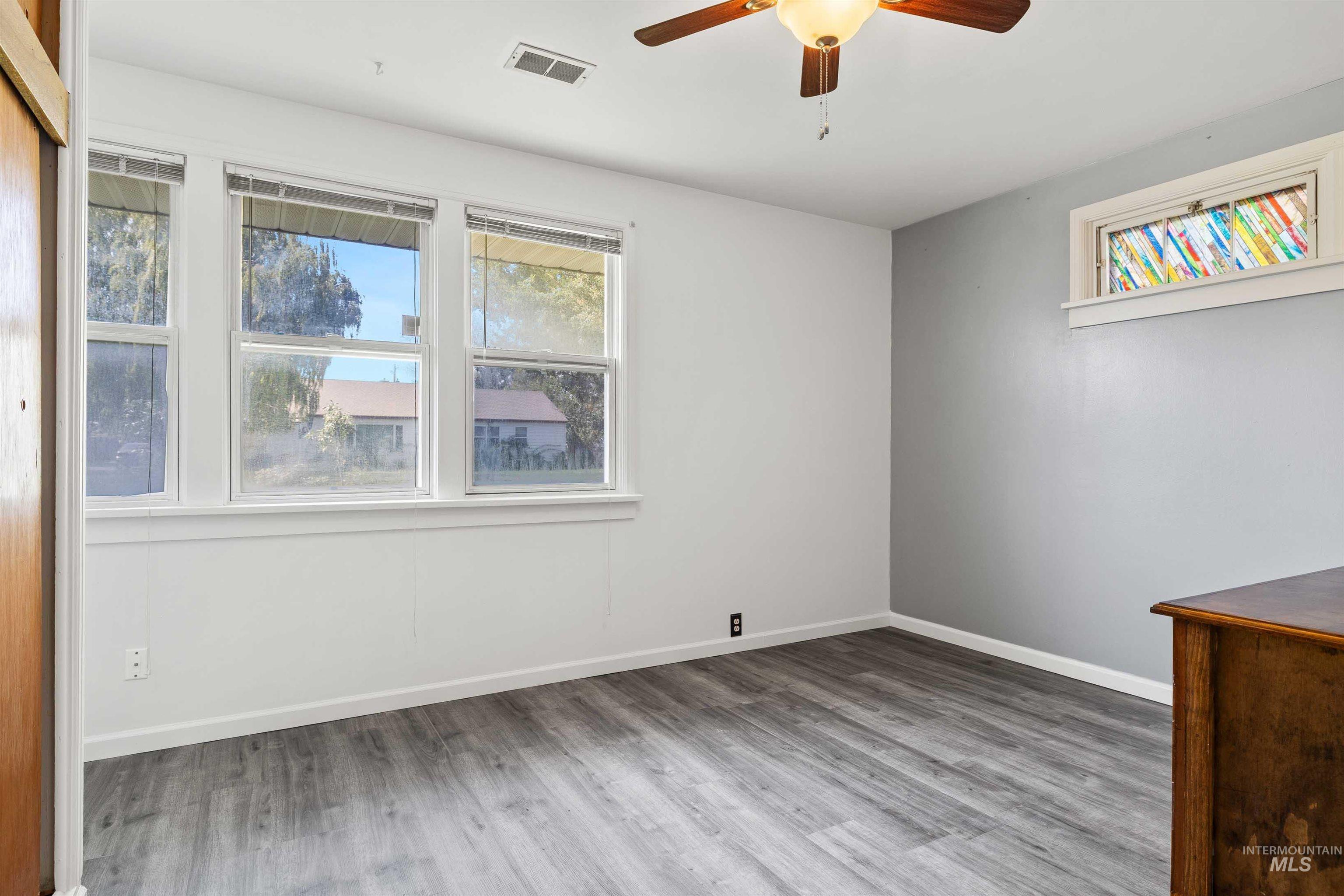 817 Union Avenue Filer, ID 83328 - Photo 16 of 37 Empty room featuring light wood-style floors and ceiling fan