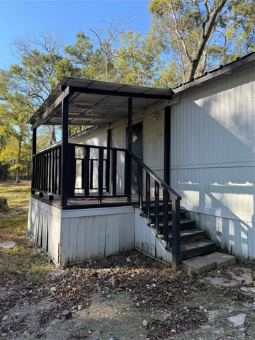 a view of entryway with wooden stairs