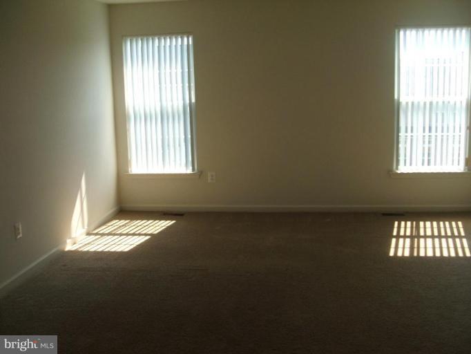 18408 Cornflower Road Boyds, MD 20841 - Photo 14 of 29 a view of an empty room with a window