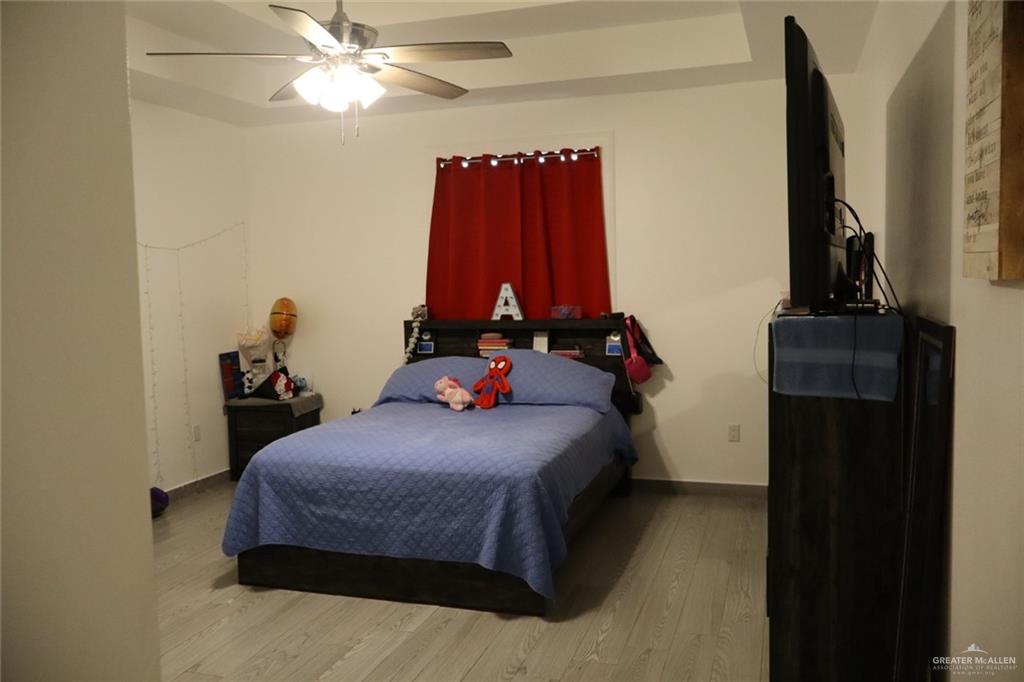 1034 Sunrise Rio Grande City, TX 78582 - Photo 12 of 37 a bedroom with a bed and a closet