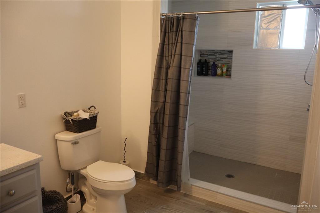 1034 Sunrise Rio Grande City, TX 78582 - Photo 16 of 37 a bathroom with a toilet and a shower