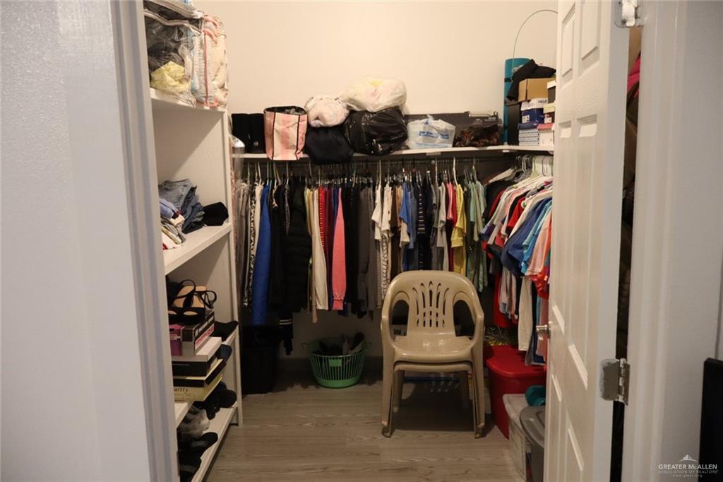 1034 Sunrise Rio Grande City, TX 78582 - Photo 21 of 37 a view of walk in closet with clothes and shoes