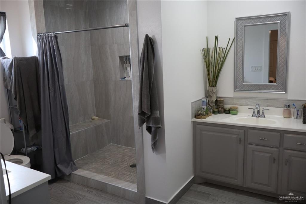 1034 Sunrise Rio Grande City, TX 78582 - Photo 22 of 37 a bathroom with a shower and a sink