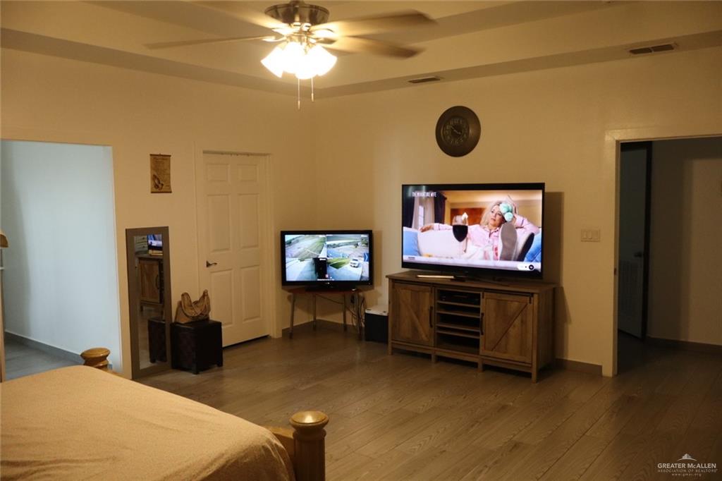 1034 Sunrise Rio Grande City, TX 78582 - Photo 26 of 37 a bedroom with furniture and a flat screen tv