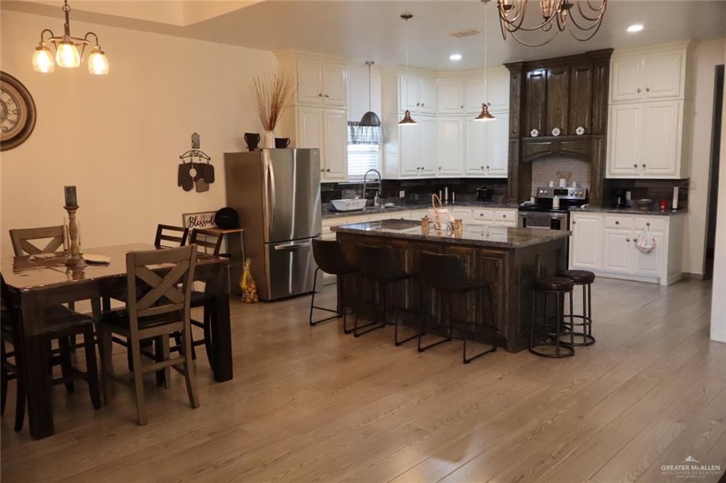 1034 Sunrise Rio Grande City, TX 78582 - Photo 4 of 37 a large kitchen with a table and chairs