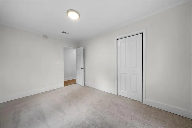 a view of an empty room with a fan