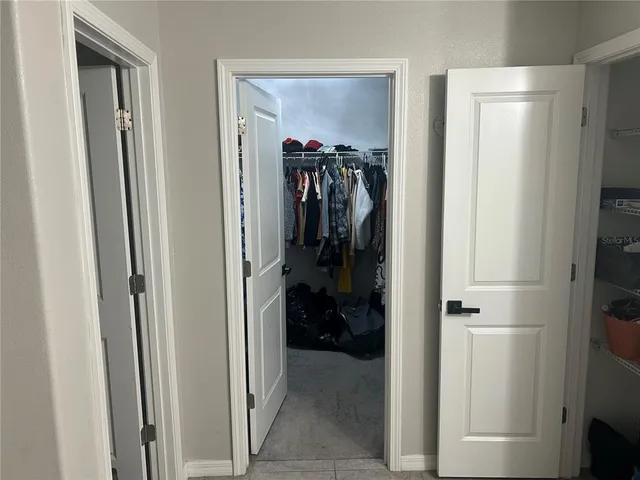 a bedroom with a bed and a chair