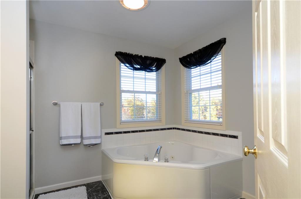 4000 Oak Point Circle McKees Rocks, PA 15136 - Photo 17 of 25 The first of FOUR bathrooms! This is just one view of the Master Bath which includes a soaking tub, separate walk in shower and a double vanity.