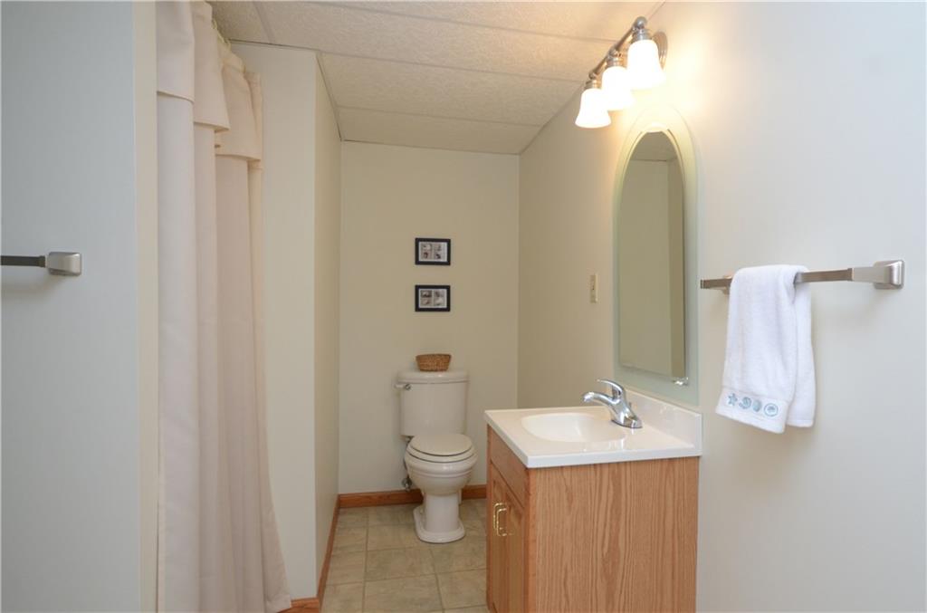 4000 Oak Point Circle McKees Rocks, PA 15136 - Photo 19 of 25 This is the THIRD of the four bathrooms. This is a full bath located on the Lower Level. This can serve as a Changing Room for Pool Guests as it is just STEPS to outside! Offers a stand in shower and is adjacent to the Family Room.