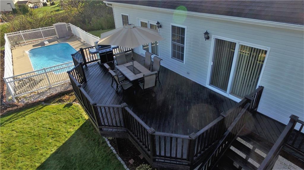 4000 Oak Point Circle McKees Rocks, PA 15136 - Photo 22 of 25 Wrap around deck is accessible to inside by TWO sets of patio doors. There is also a gate to keep pets and little ones safe and contained. Stairs lead down to the backyard.