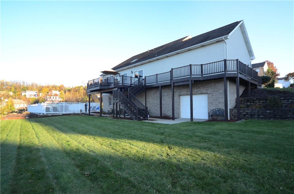 4000 Oak Point Circle McKees Rocks, PA 15136 - Photo 24 of 25 Amazing backyard. Also shown is the 3rd garage bay accessible by both garage door to outside and an interior steel door to basement. Perfect space to store all your summer gear, pool equipment, patio furniture & More!