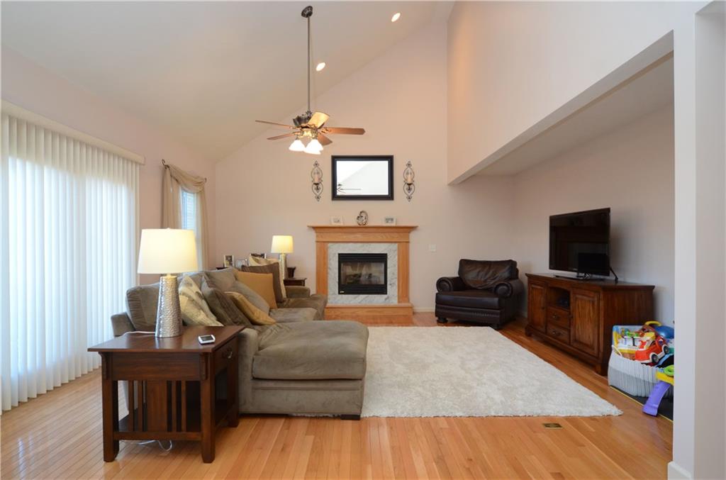 4000 Oak Point Circle McKees Rocks, PA 15136 - Photo 5 of 25 Soaring Ceilings in Family Room and all hardwood floors! Gas Fireplace keeps you warm and cozy too on chilly days!