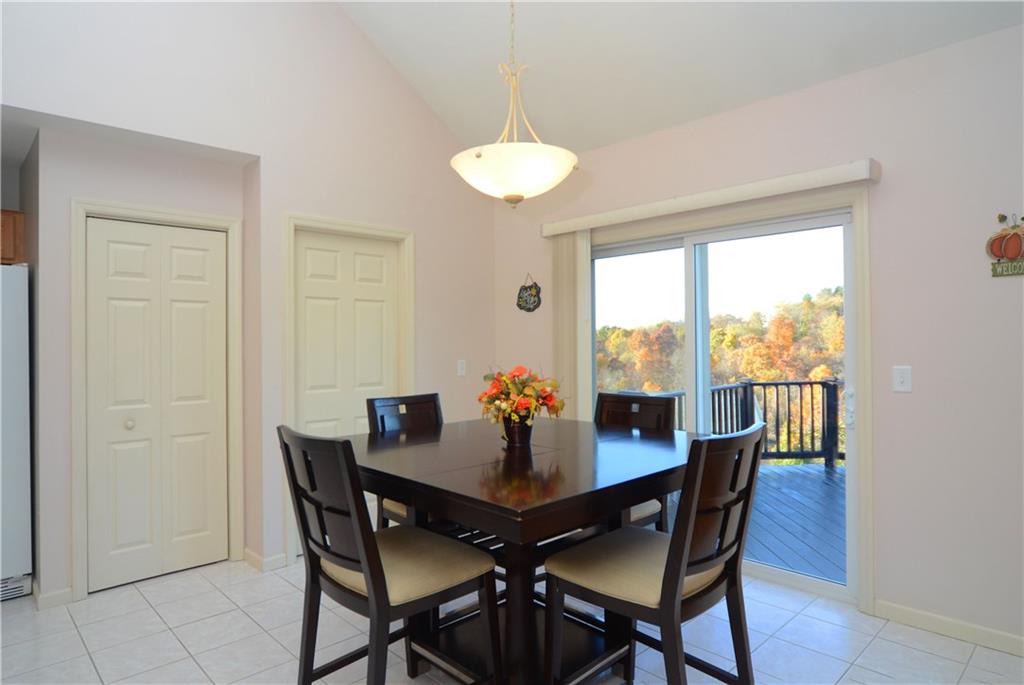 4000 Oak Point Circle McKees Rocks, PA 15136 - Photo 6 of 25 Again soaring cathedral ceilings make the rooms feel even more spacious than they are. Two sets of patio doors lead from both dining areas AND family room.