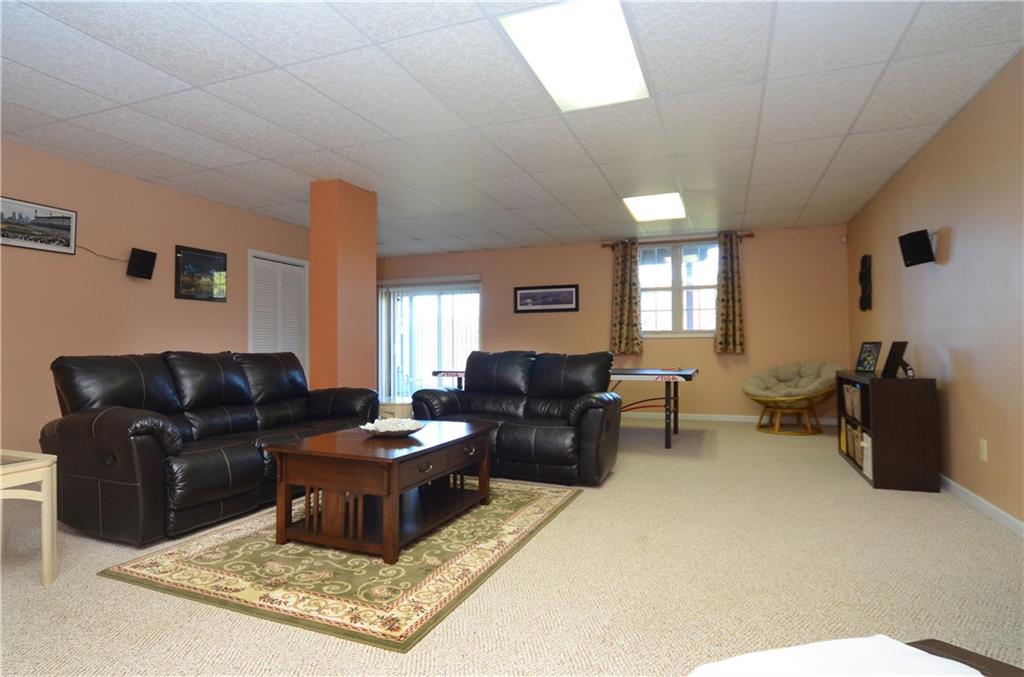 4000 Oak Point Circle McKees Rocks, PA 15136 - Photo 9 of 25 You won't believe this awesome Gameroom on the Lower Level! The basement is completely finished out with 10' high ceilings! Berber carpet throughout and patio doors leading to concrete patio and backyard.