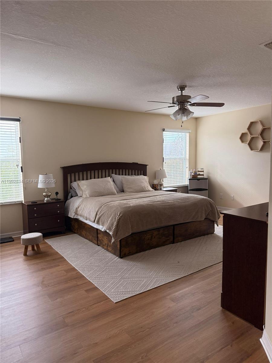 3154 Rodrick Circle Orlando, FL 32824 - Photo 12 of 21 a bedroom with a bed and a chandelier