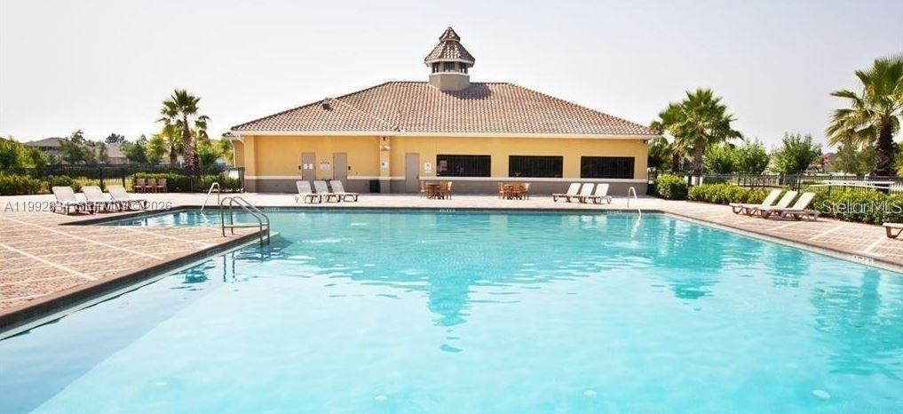3154 Rodrick Circle Orlando, FL 32824 - Photo 20 of 21 a front view of house with swimming pool yard and outdoor seating