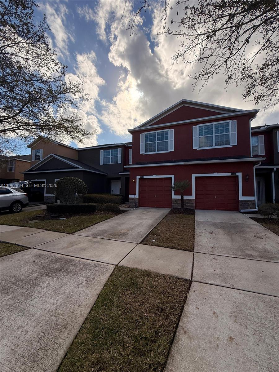 3154 Rodrick Circle Orlando, FL 32824 - Photo 2 of 21 a front view of a house with a yard