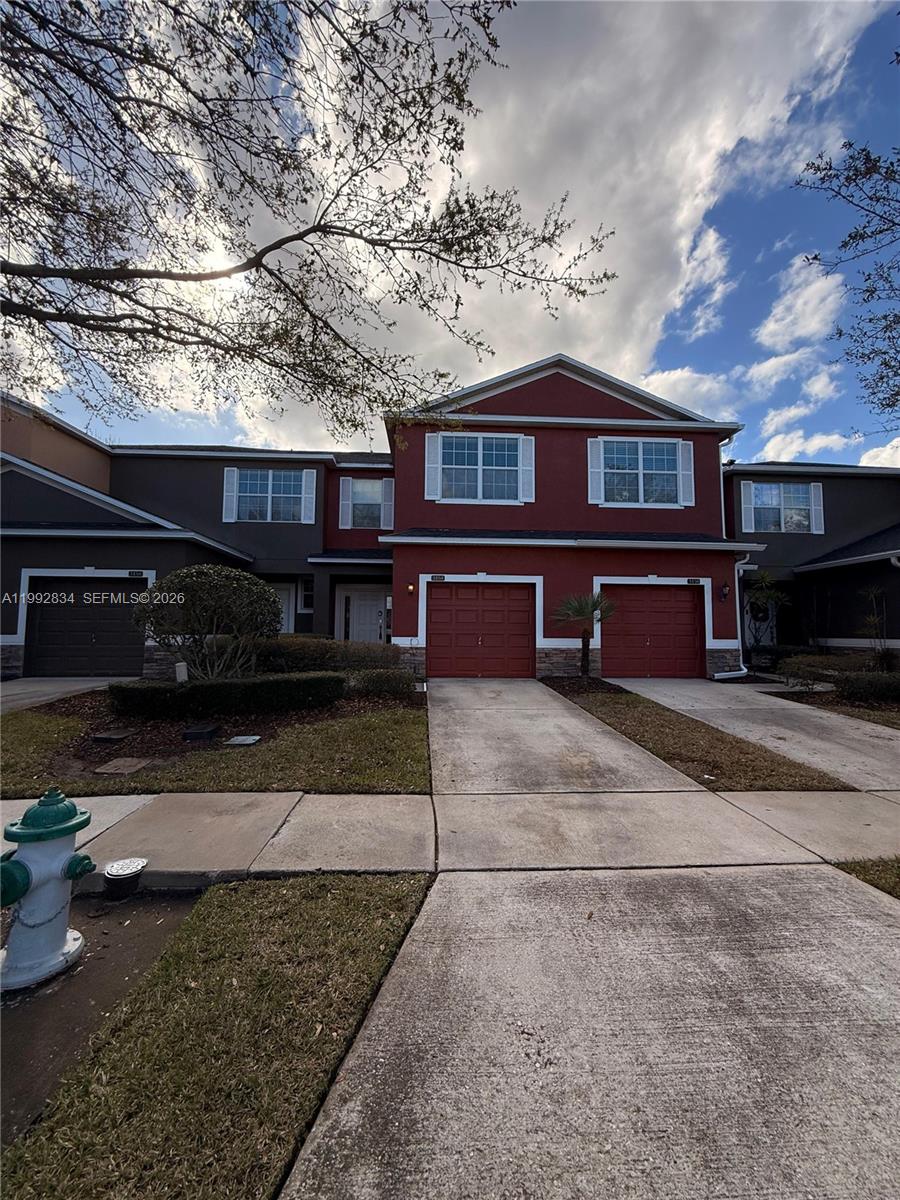 3154 Rodrick Circle Orlando, FL 32824 - Photo 3 of 21 a front view of a house with a yard