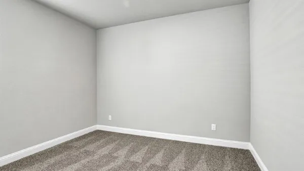 an empty room with closet area