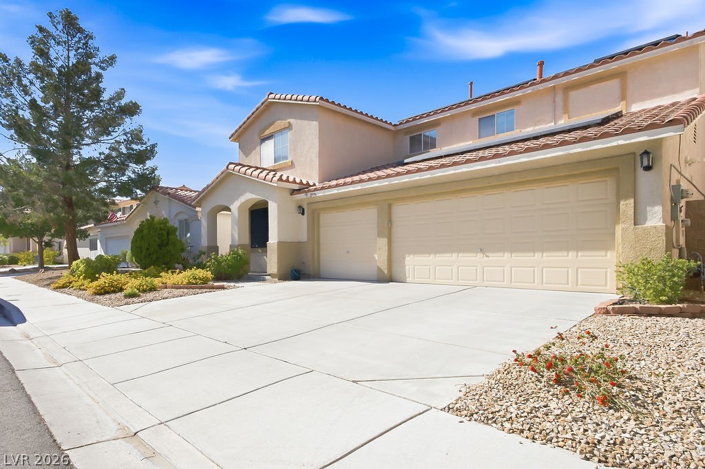 2376 Tilden Way Henderson, NV 89074 - Photo 3 of 54 Front of home including 3 car garage.