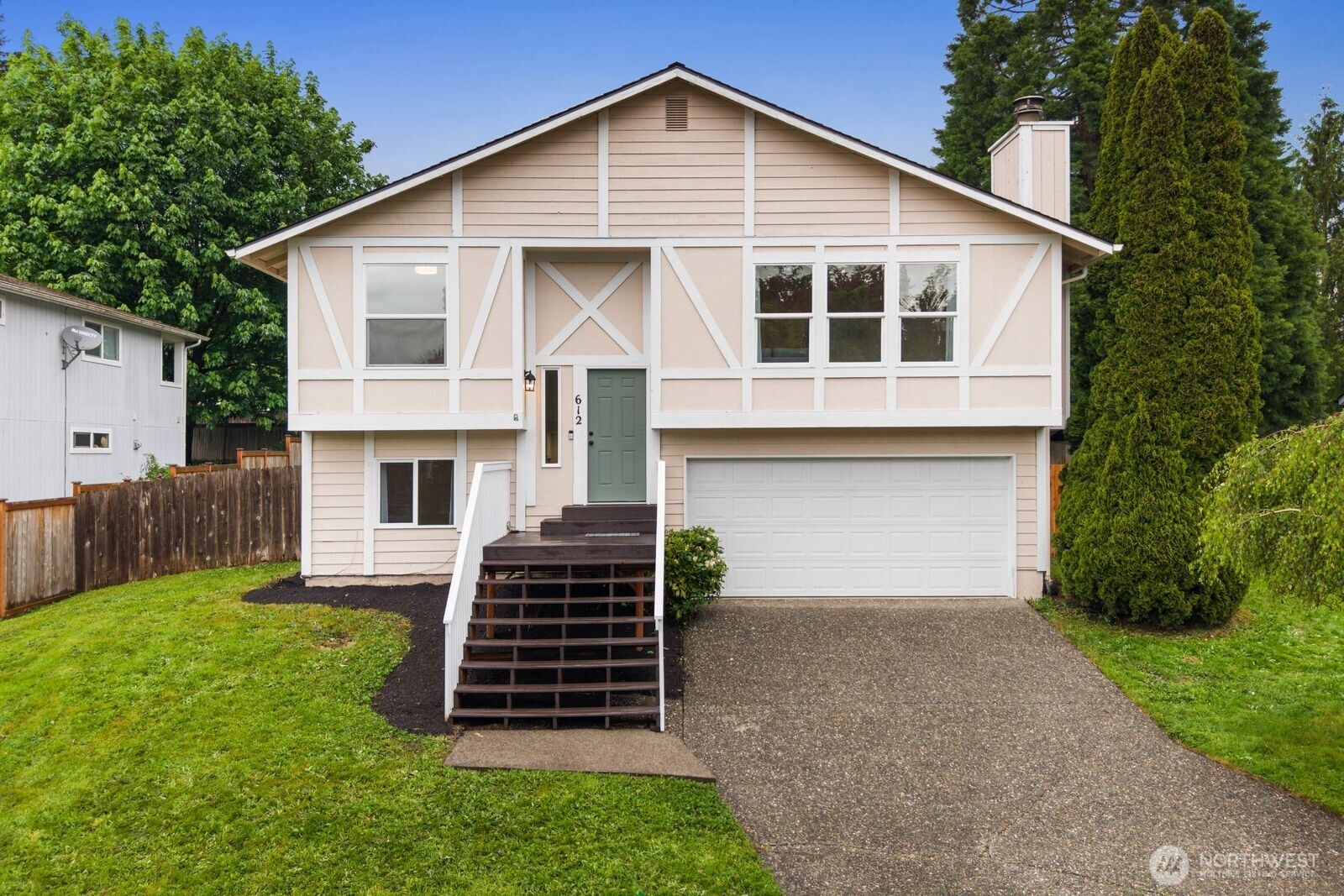 612 19th Street Snohomish, WA 98290 - Photo 1 of 33 a front view of a house with a yard and garage