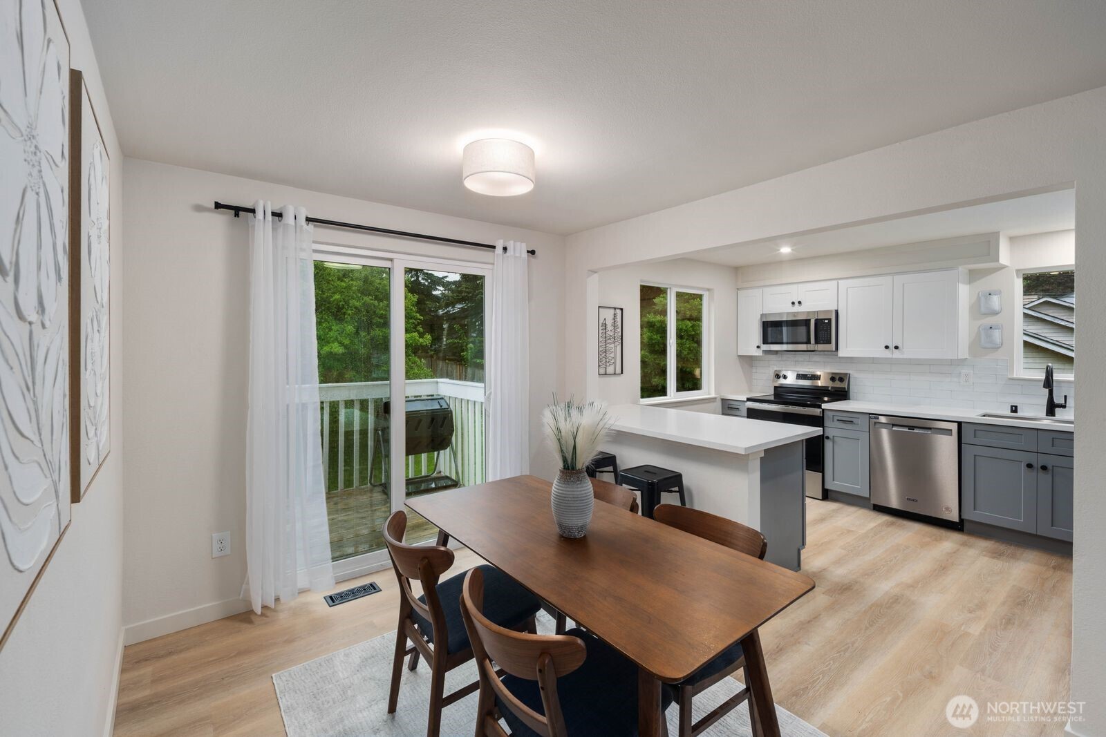 612 19th Street Snohomish, WA 98290 - Photo 12 of 33 a kitchen with a table chairs sink and cabinets