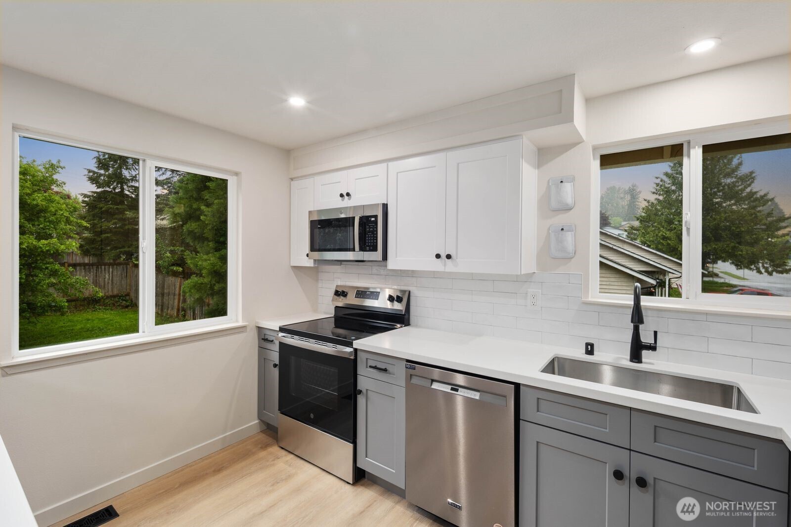 612 19th Street Snohomish, WA 98290 - Photo 13 of 33 a kitchen with a sink stove top oven and cabinets