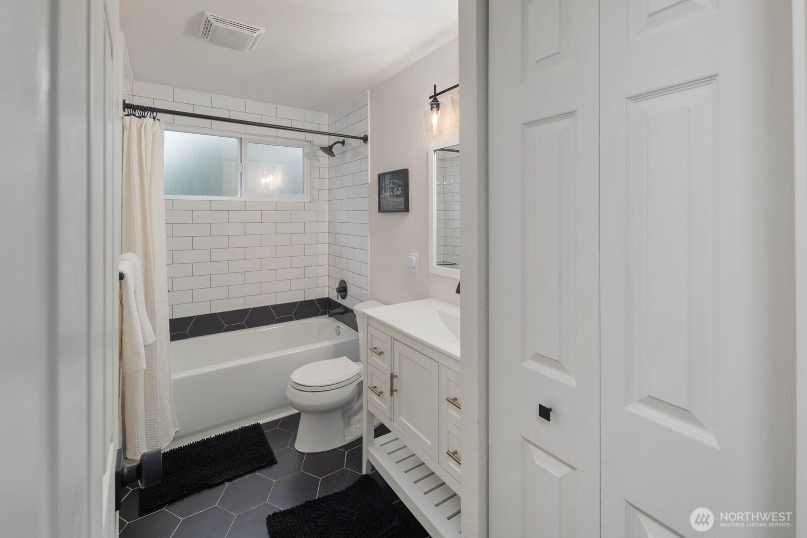 612 19th Street Snohomish, WA 98290 - Photo 17 of 33 a bathroom with a granite countertop toilet a sink and bathtub