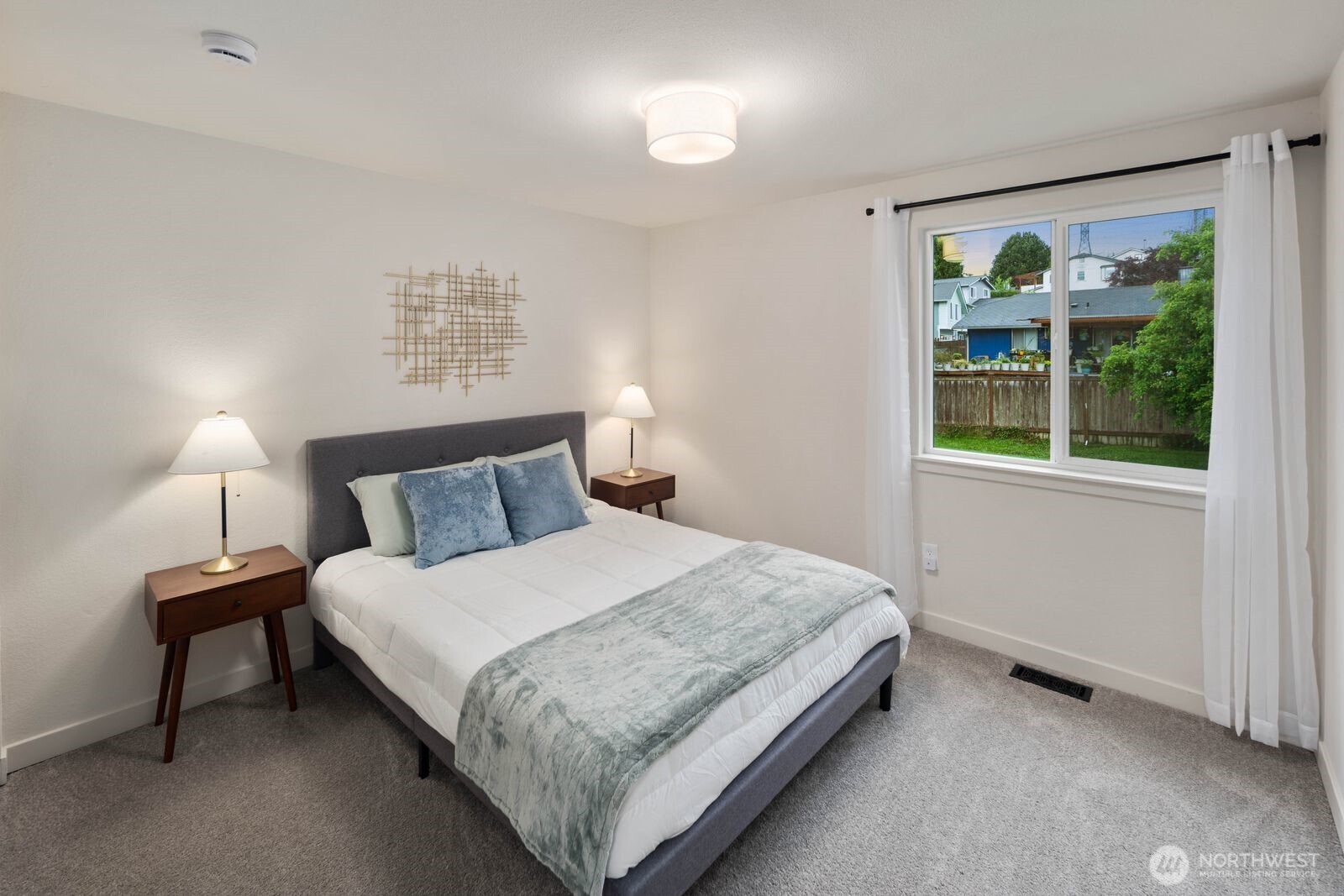 612 19th Street Snohomish, WA 98290 - Photo 19 of 33 a bedroom with a bed and a night stand