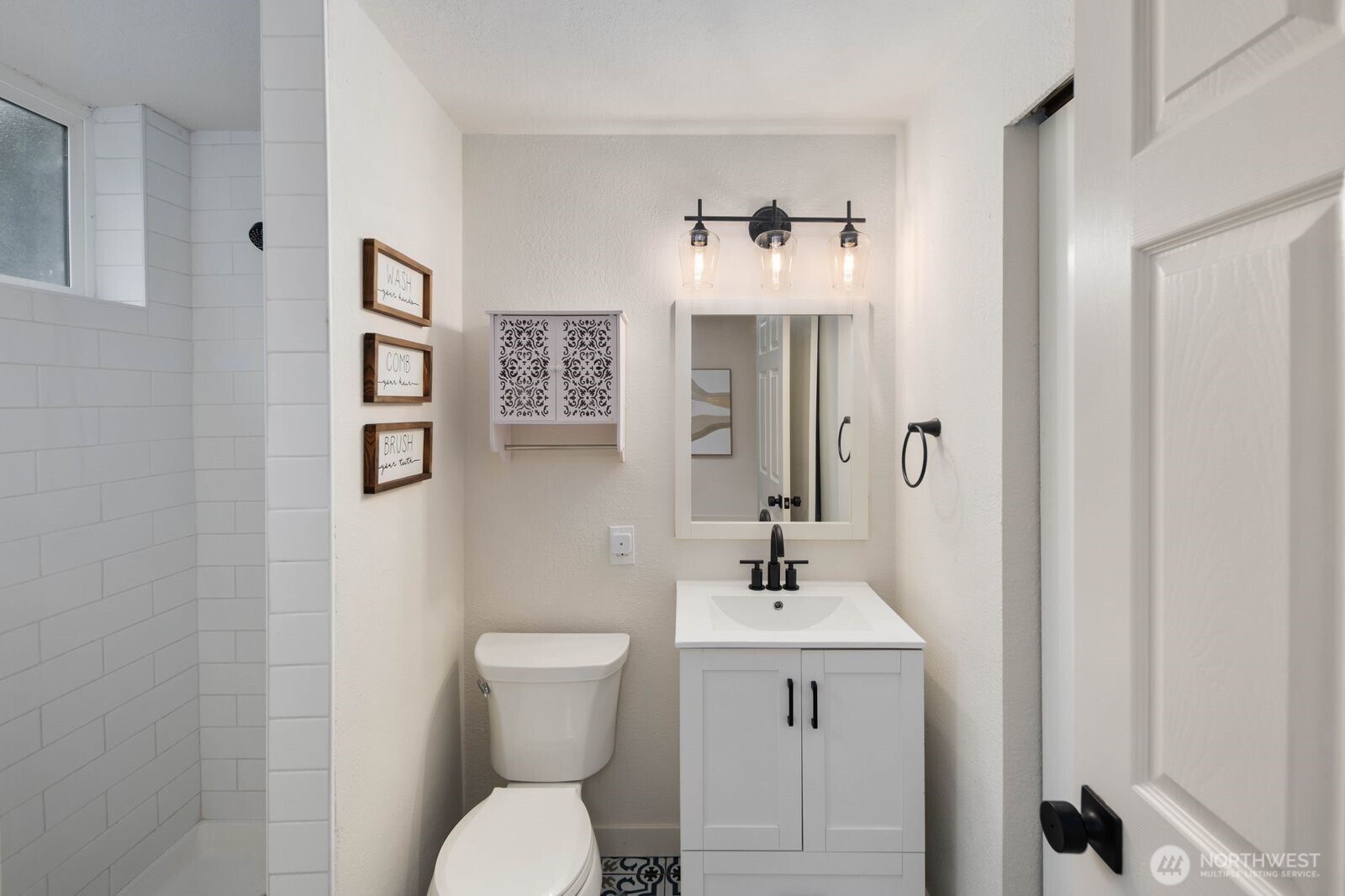 612 19th Street Snohomish, WA 98290 - Photo 25 of 33 a bathroom with a toilet sink and mirror
