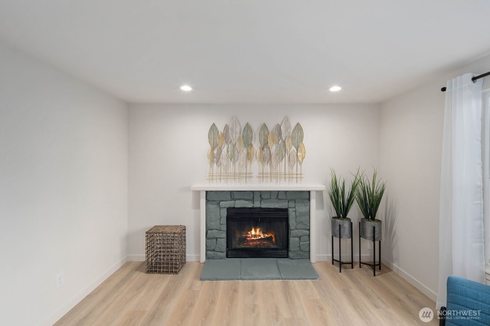 612 19th Street Snohomish, WA 98290 - Photo 7 of 33 a living room with a fireplace and wooden floor