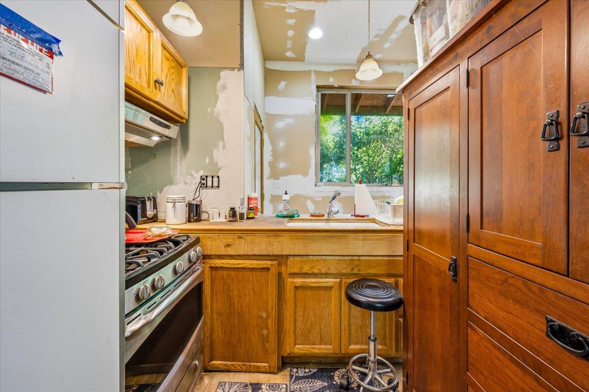 19643 Sages Road Nevada City, CA 95959 - Photo 11 of 39 a bathroom with a sink a mirror and next to a window