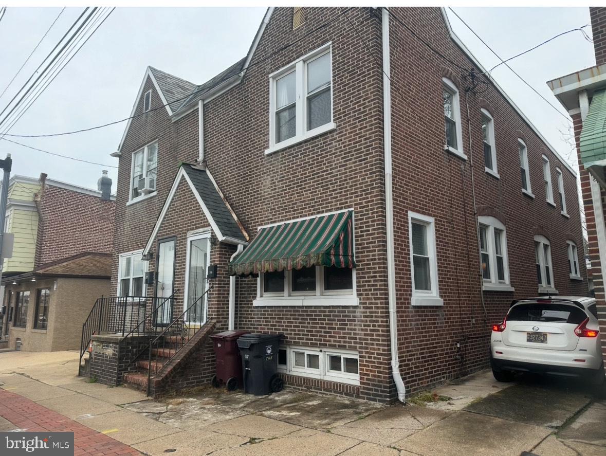 a front view of a house with parking