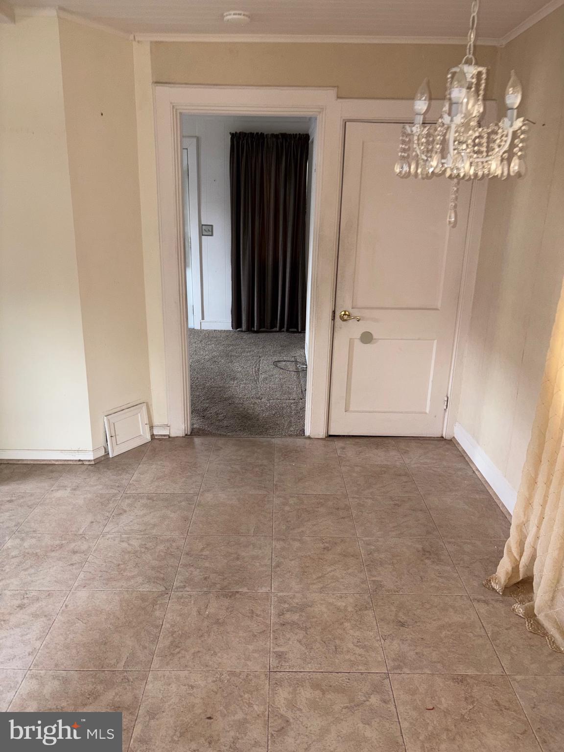 25 Baker Street Aberdeen, MD 21001 - Photo 11 of 23 a view of a big room with chandelier and windows