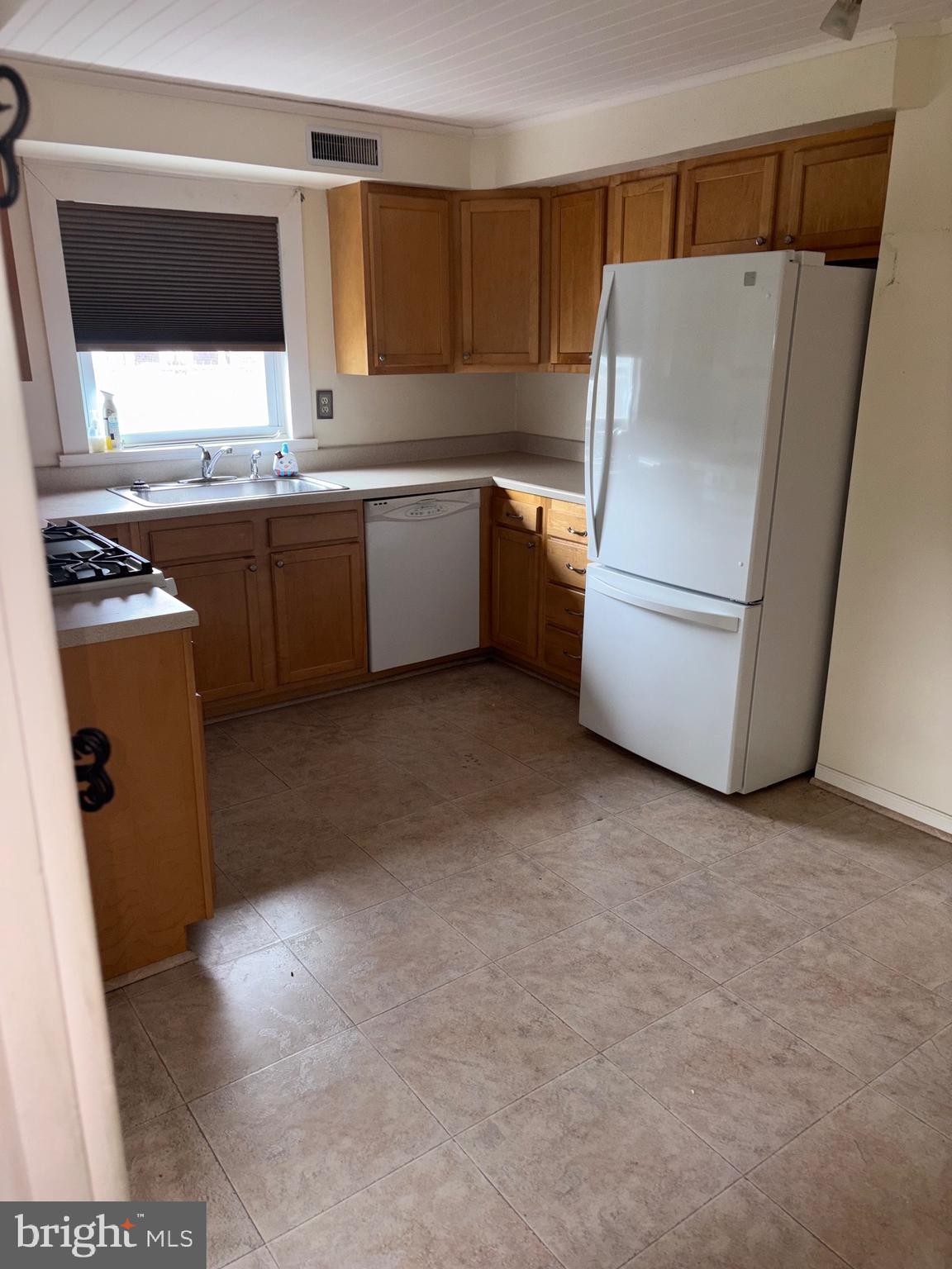 25 Baker Street Aberdeen, MD 21001 - Photo 12 of 23 a kitchen with a refrigerator sink and stove
