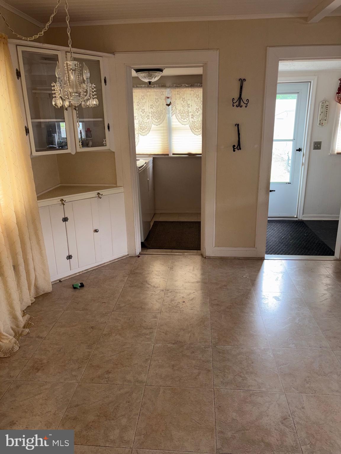 25 Baker Street Aberdeen, MD 21001 - Photo 14 of 23 a view of a hallway with wooden floor and windows
