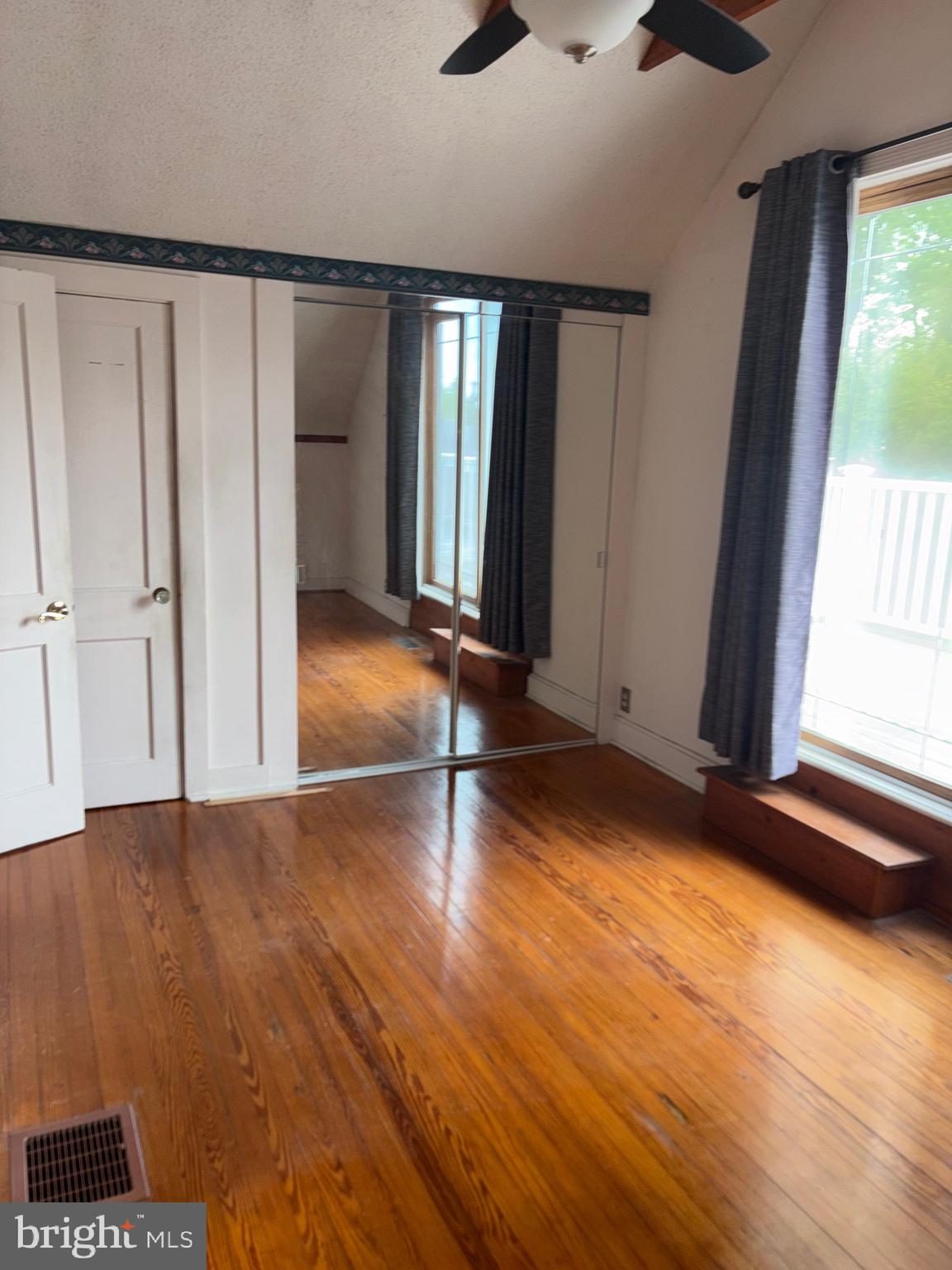 25 Baker Street Aberdeen, MD 21001 - Photo 16 of 23 a view of empty room with wooden floor and fan