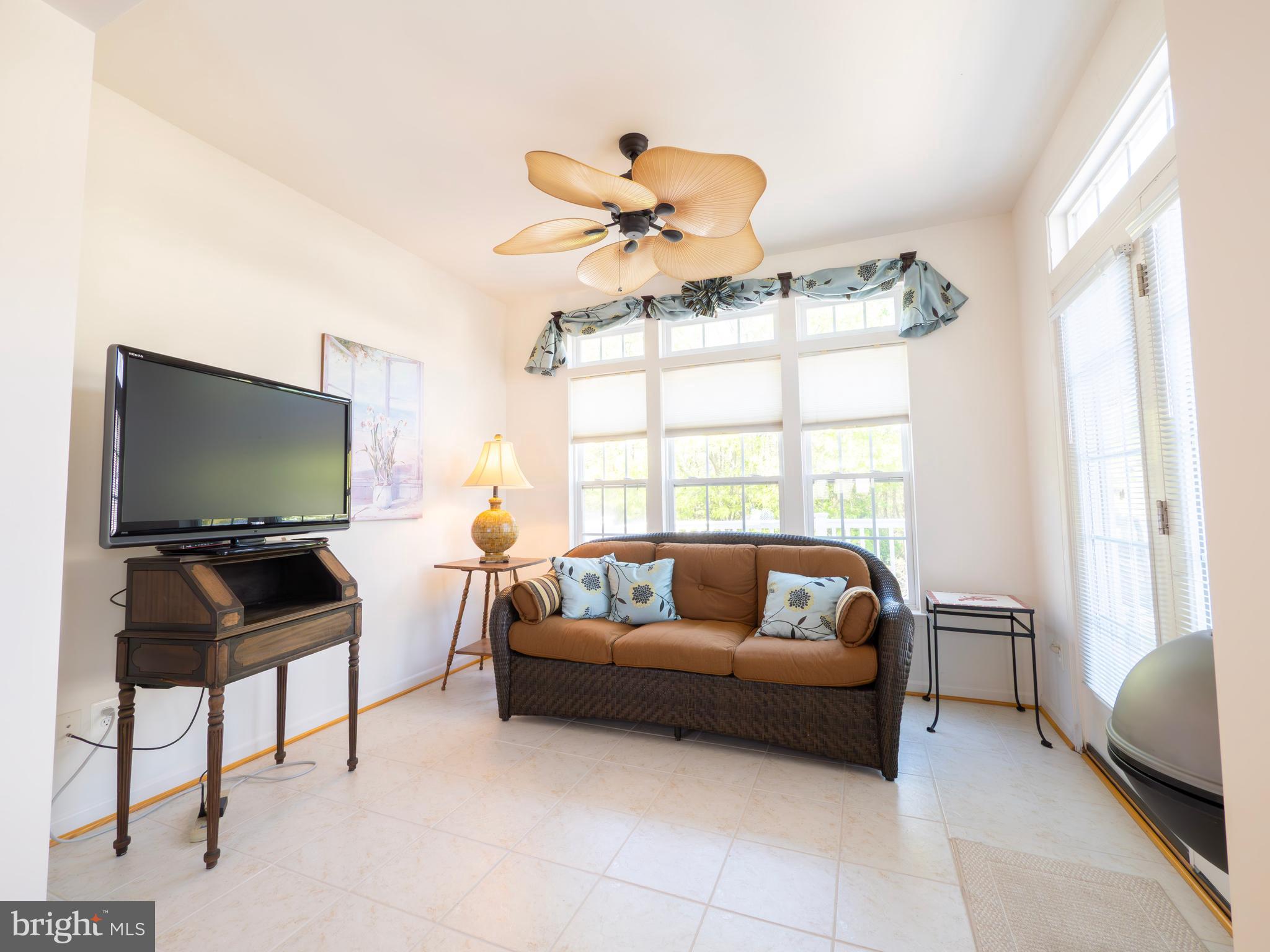 301 Monroe Point Drive Colonial Beach, VA 22443 - Photo 15 of 33 a living room with furniture and a flat screen tv