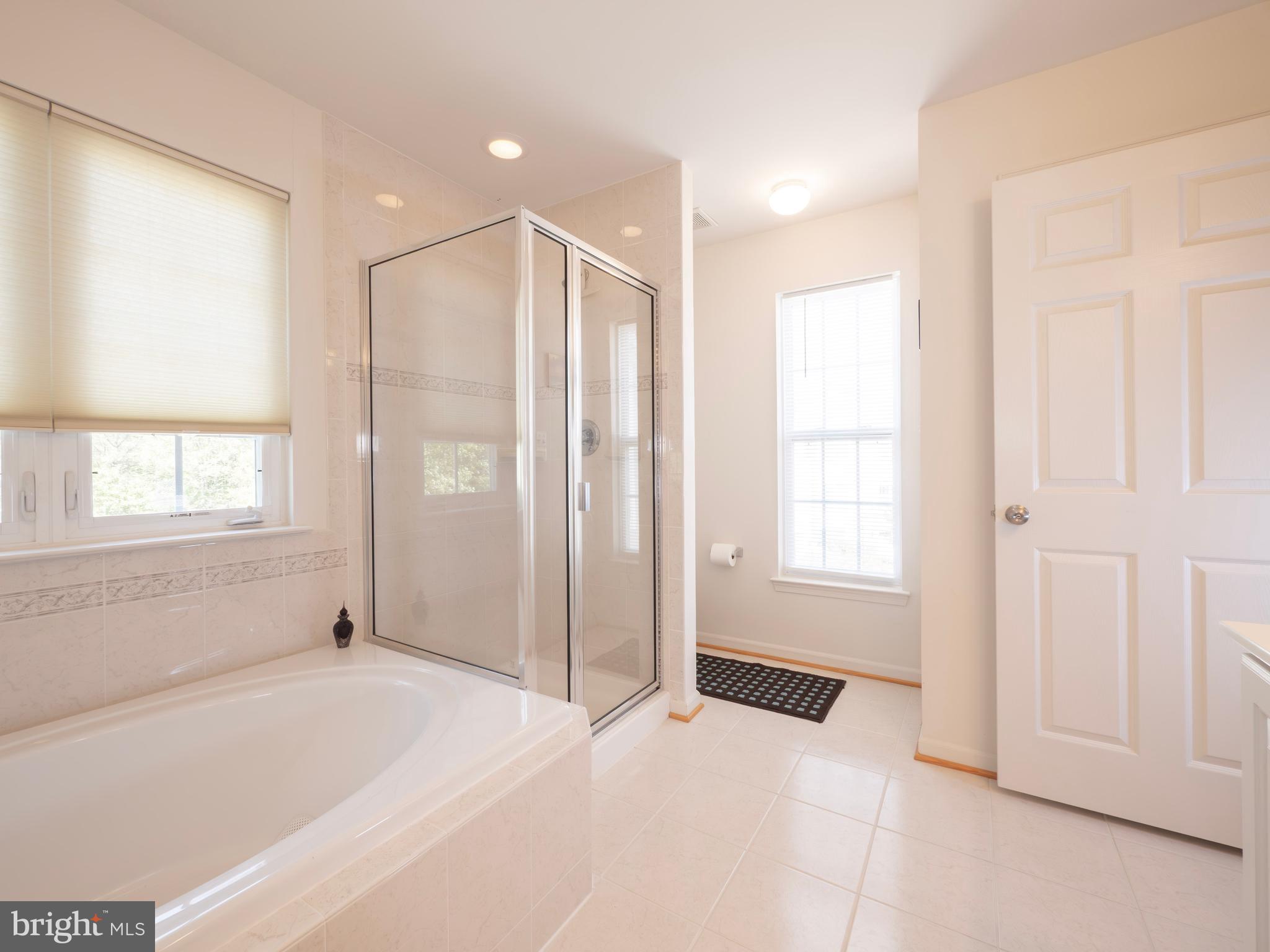 301 Monroe Point Drive Colonial Beach, VA 22443 - Photo 21 of 33 a bathroom with a bathtub and a shower