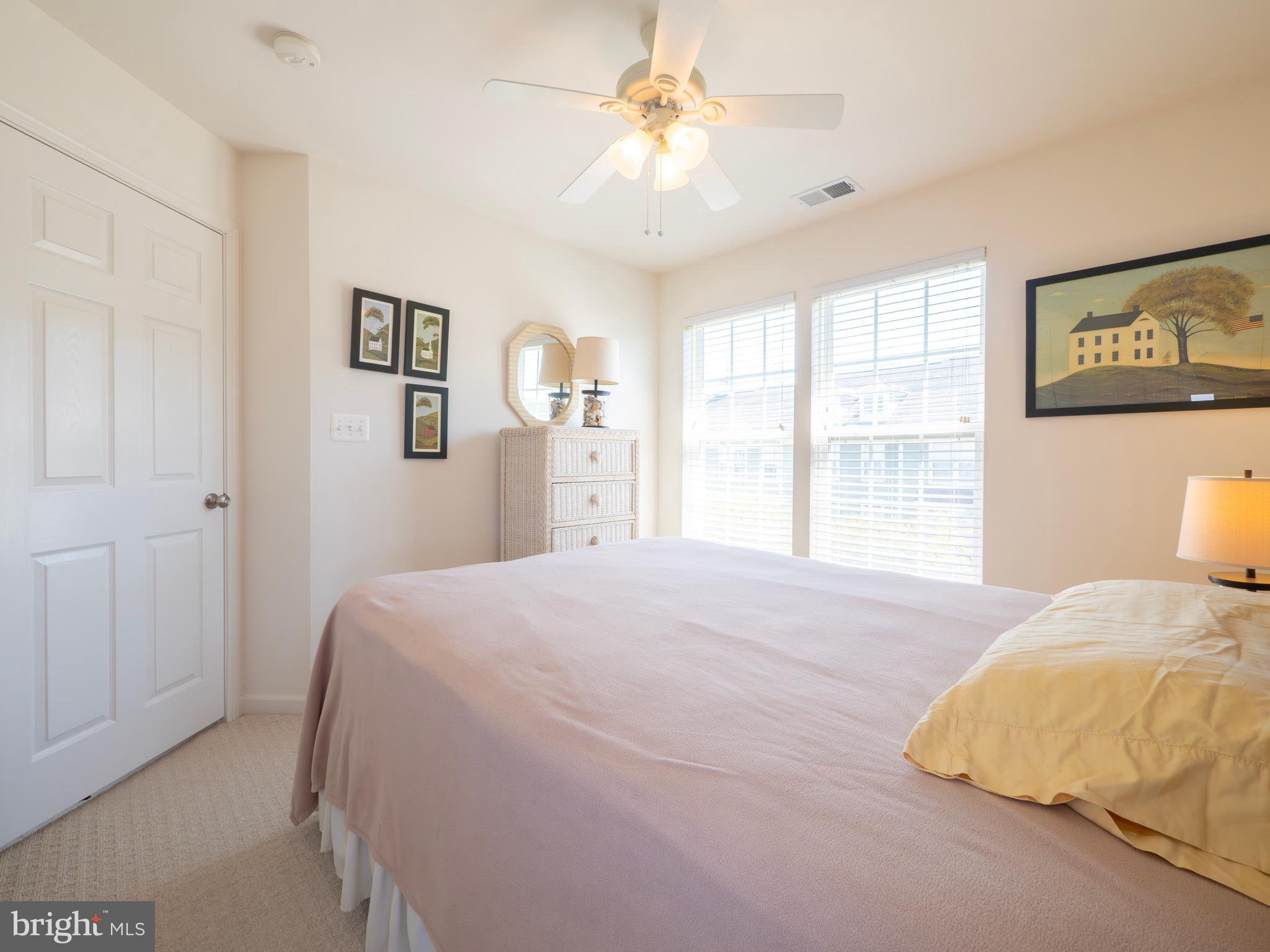 301 Monroe Point Drive Colonial Beach, VA 22443 - Photo 23 of 33 a bedroom with a large bed and a chandelier