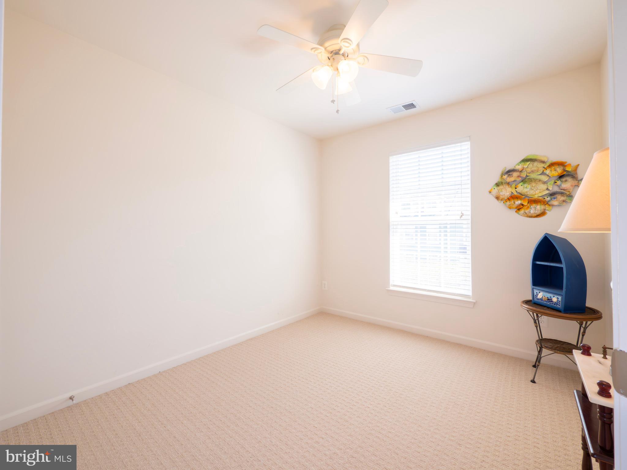 301 Monroe Point Drive Colonial Beach, VA 22443 - Photo 26 of 33 an empty room with windows and fan