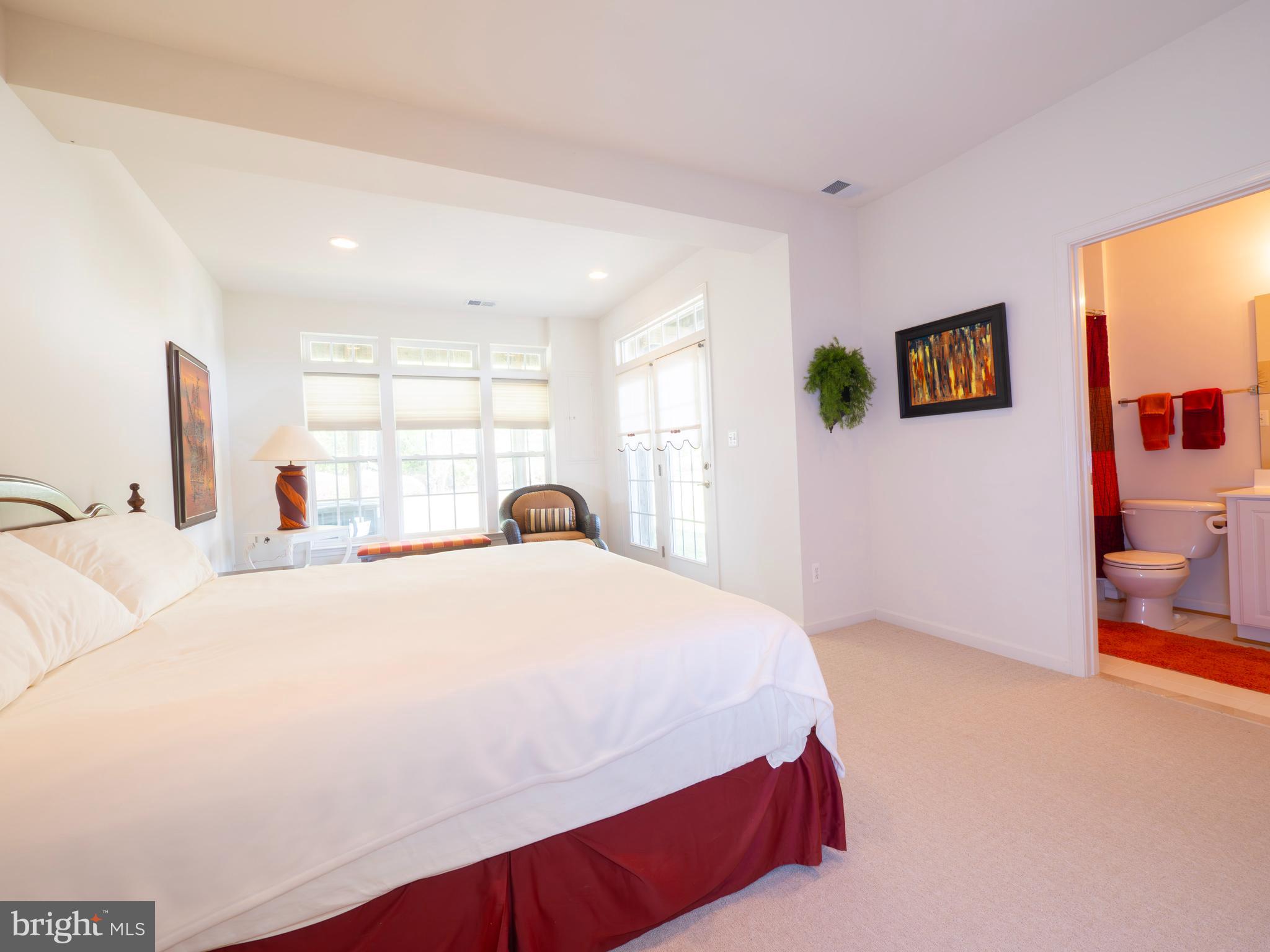 301 Monroe Point Drive Colonial Beach, VA 22443 - Photo 6 of 33 a bedroom with a bed and a flat screen tv
