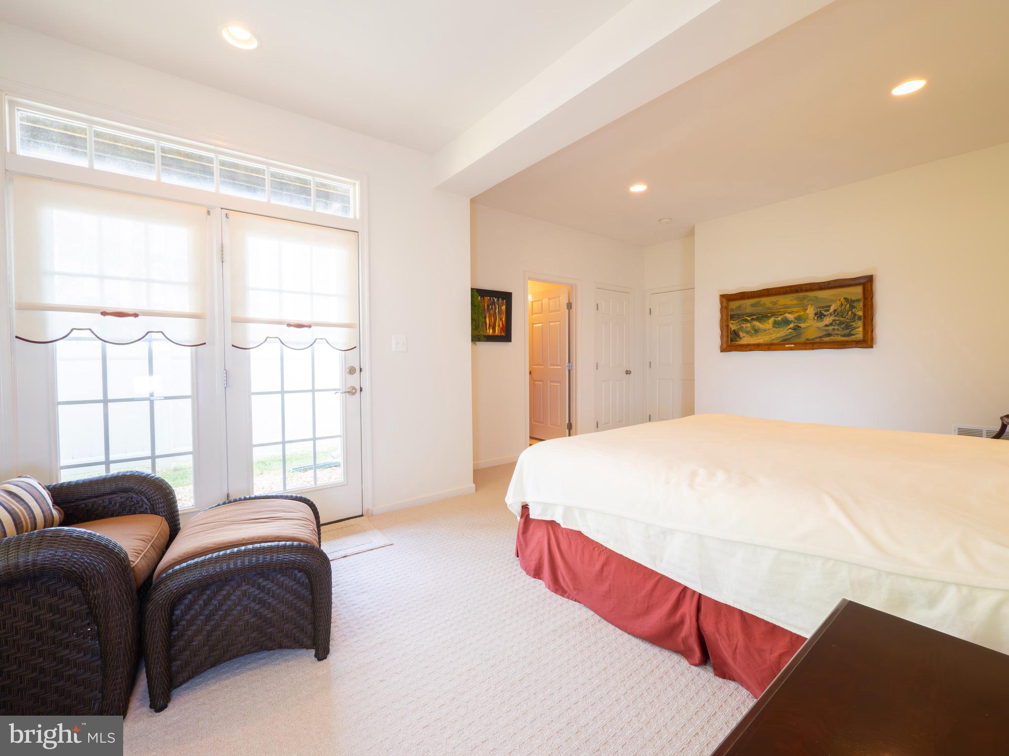 301 Monroe Point Drive Colonial Beach, VA 22443 - Photo 7 of 33 a bedroom with a bed and a large window