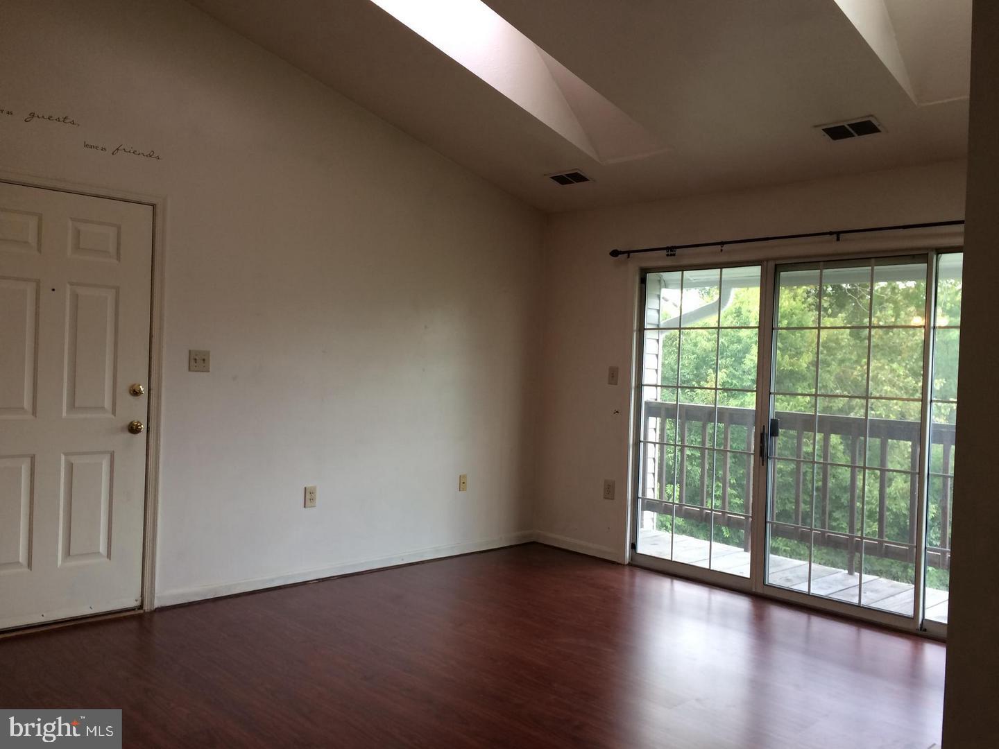 104 Timberlake Terrace, Unit 12 Stephens City, VA 22655 - Photo 3 of 8 a view of wooden floor and windows in a room