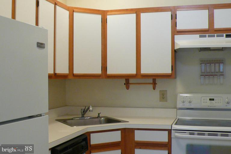 104 Timberlake Terrace, Unit 12 Stephens City, VA 22655 - Photo 4 of 8 a view of a room with a sink and cabinets