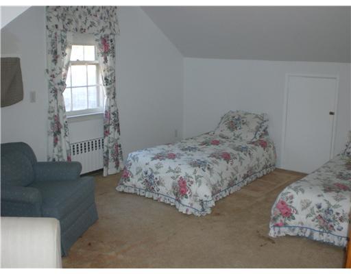 137 Cutler Road Greenwich, CT 06831 - Photo 19 of 20 a bedroom with a bed and a window