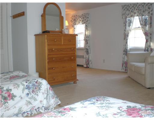 137 Cutler Road Greenwich, CT 06831 - Photo 20 of 20 a bedroom with a bed and a dresser